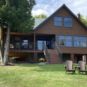 Log home that had the exterior painted by Brennan home painting.